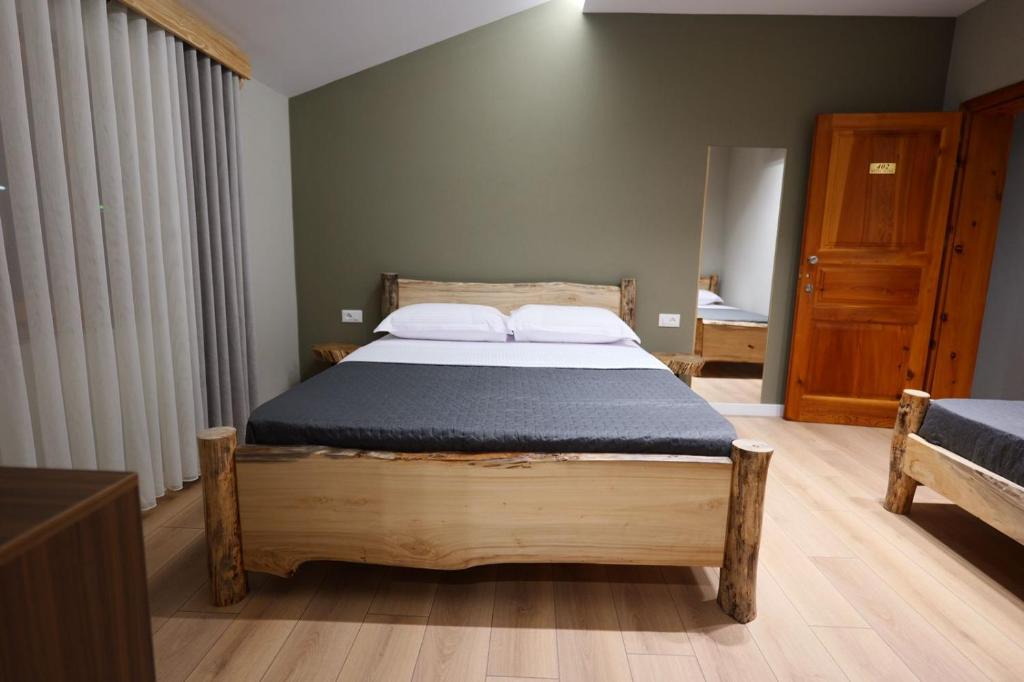 Postel nebo postele na pokoji v ubytování Hotel Ikona