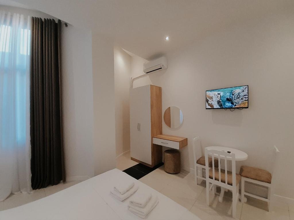 TV a/nebo společenská místnost v ubytování Hotel Restaurant Univers