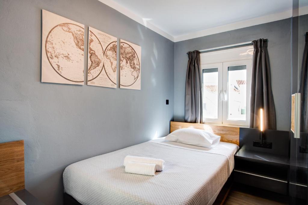 Postel nebo postele na pokoji v ubytování Agora Apartments