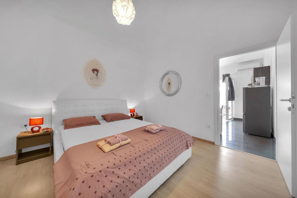 Postel nebo postele na pokoji v ubytování Casa Del Porto - Vis