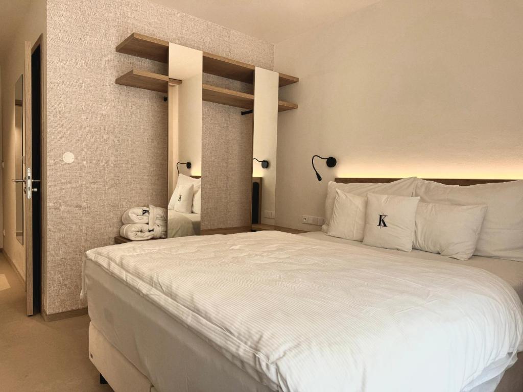 Postel nebo postele na pokoji v ubytování Wellness penzion Lázně Kvilda