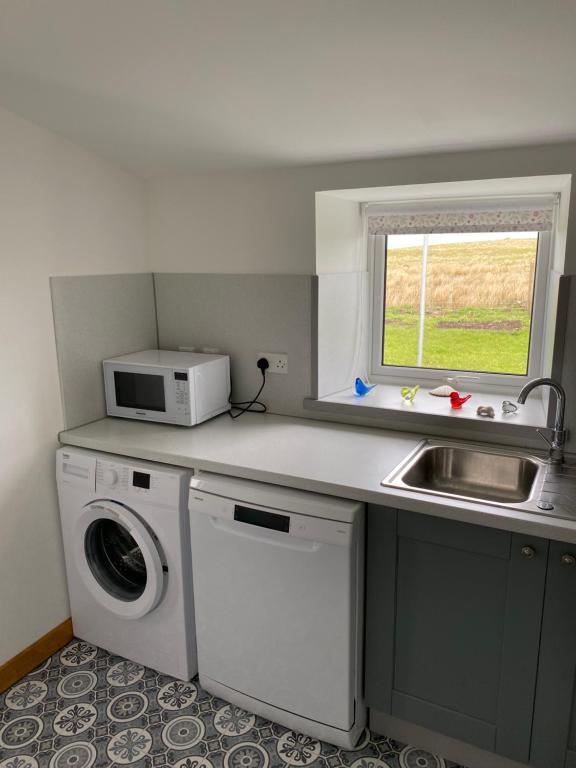 Kuchyň nebo kuchyňský kout v ubytování Cnoc Ruaraidh Cottage
