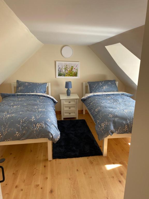 Postel nebo postele na pokoji v ubytování Cnoc Ruaraidh Cottage