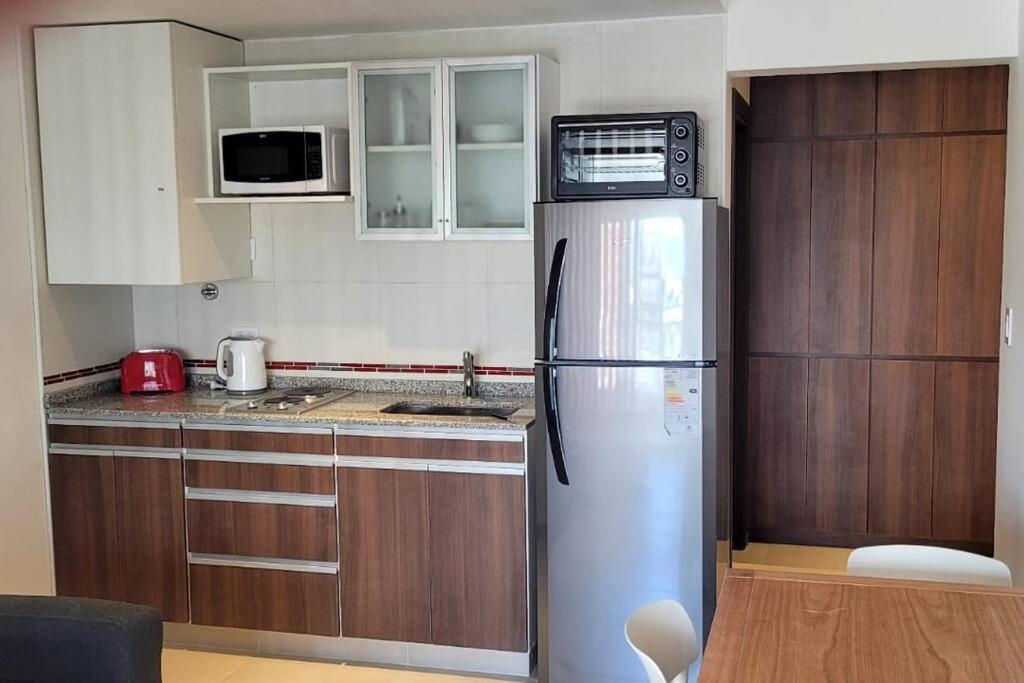 Kuchyň nebo kuchyňský kout v ubytování departamento a estrenar 4 pax