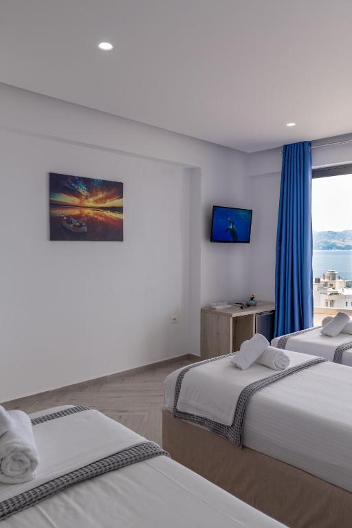 Postel nebo postele na pokoji v ubytování Sea View Hotel