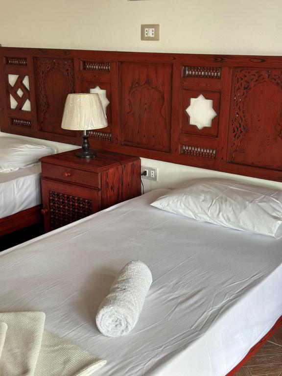 Postel nebo postele na pokoji v ubytování Ali Baba Hotel