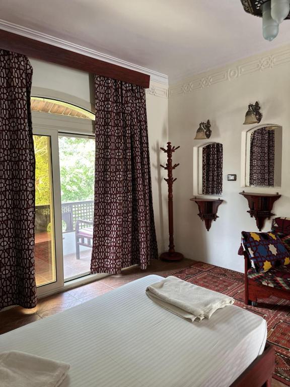 Postel nebo postele na pokoji v ubytování Ali Baba Hotel