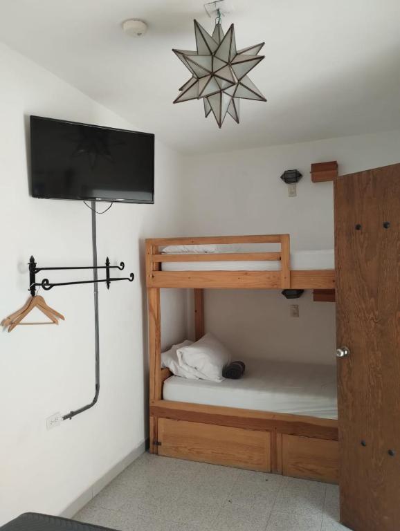 Postel nebo postele na pokoji v ubytování La Catrina Hostel