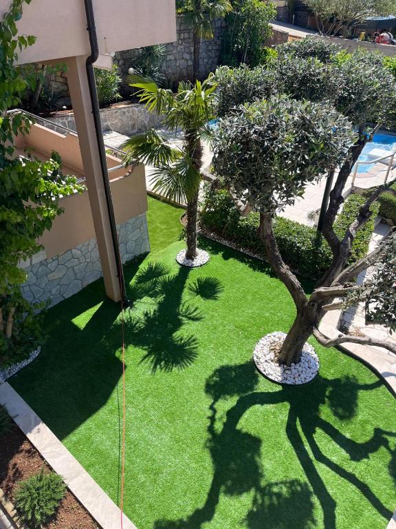 an overhead view of a garden with trees and grass at APARTMENTS HOUSE BARBARA 2 in Kornić
