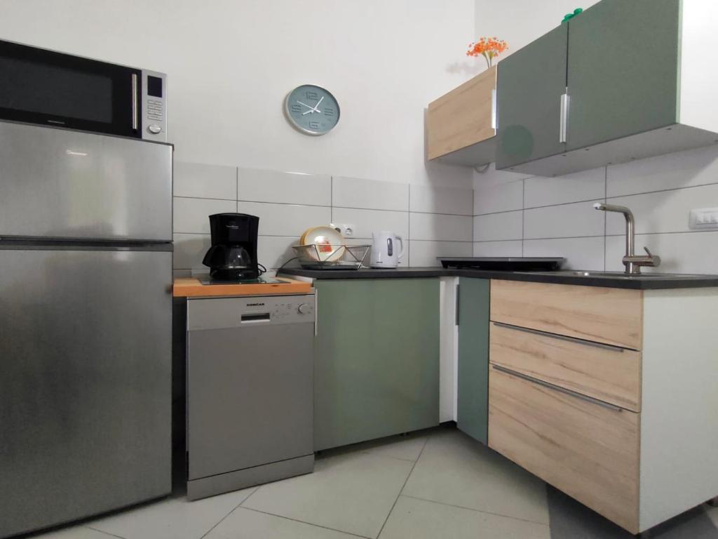 Kuchyň nebo kuchyňský kout v ubytování Rafael Apartments