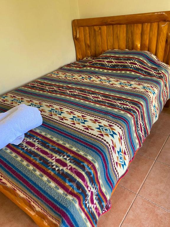 Postel nebo postele na pokoji v ubytování Casa Hotel Loma Wasi en Cotacachi