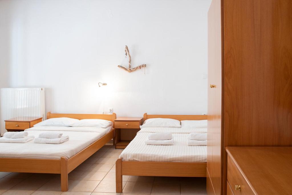 Postel nebo postele na pokoji v ubytování Gravanis Studios