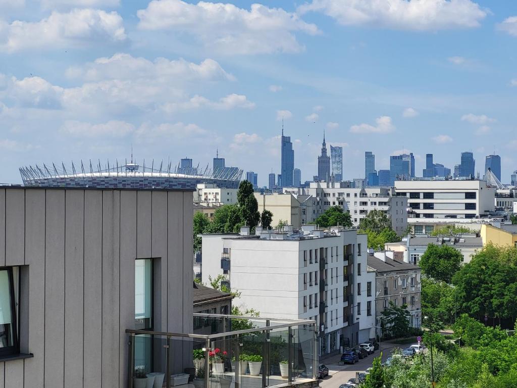 a view of a city skyline with tall buildings at Cora Lego Apartment City View near Stadium & Sinfonia Varsovia Optional Parking in Warsaw