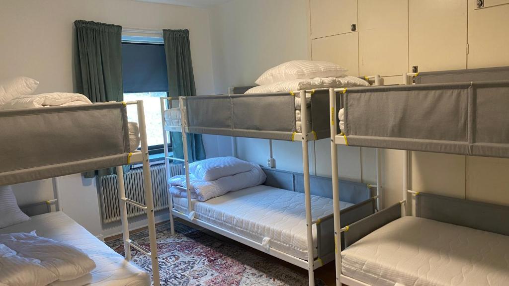 Postel nebo postele na pokoji v ubytování Sjømannskirken Narvik