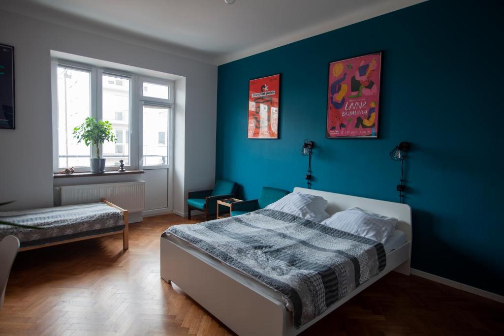 Ένα ή περισσότερα κρεβάτια σε δωμάτιο στο Centrum 51 Apartamenty