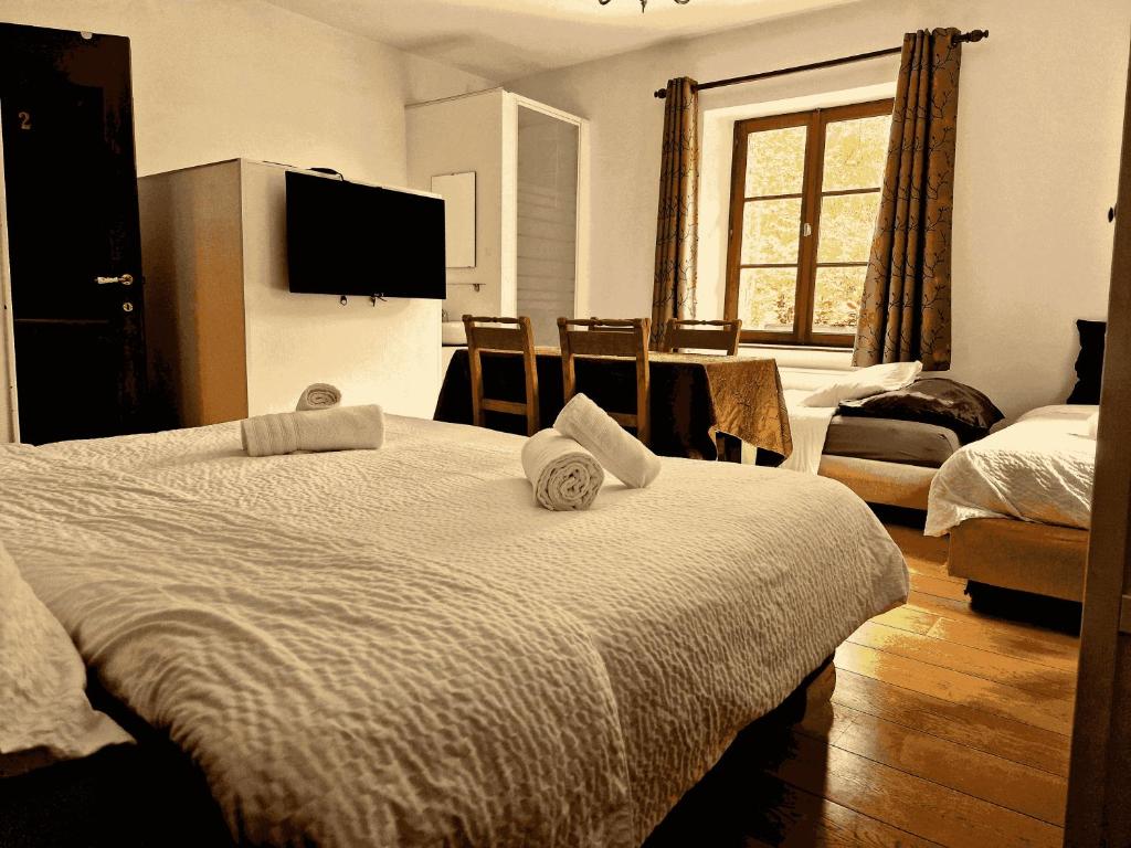 Postel nebo postele na pokoji v ubytování B&B La Source de la Géronstère