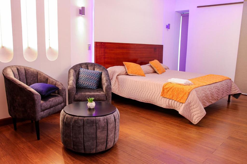 Postel nebo postele na pokoji v ubytování Hotel Villonaco
