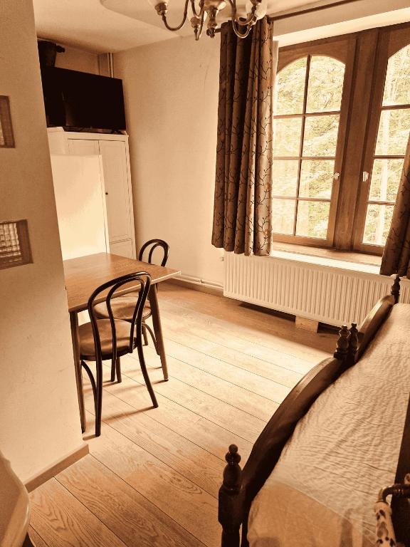 Posezení v ubytování B&B La Source de la Géronstère