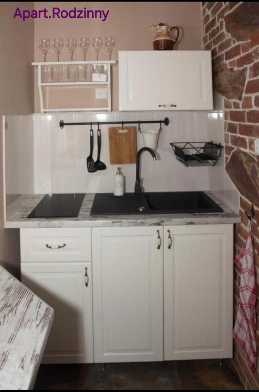 Kuchyňa alebo kuchynka v ubytovaní Apartamenty u Rzepióra