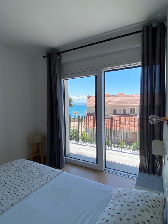 Postel nebo postele na pokoji v ubytování Apartments Bogic
