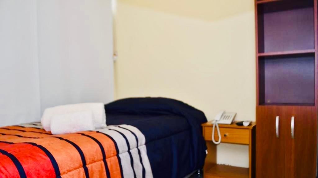 Postel nebo postele na pokoji v ubytování Hotel Blu Bascuñan