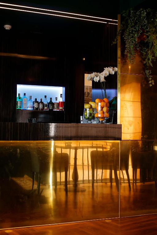 TV a/nebo společenská místnost v ubytování Radisson Blu GHR Rome