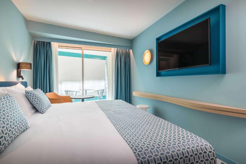 Postel nebo postele na pokoji v ubytování Barceló Benidorm Beach - Adults Recommended