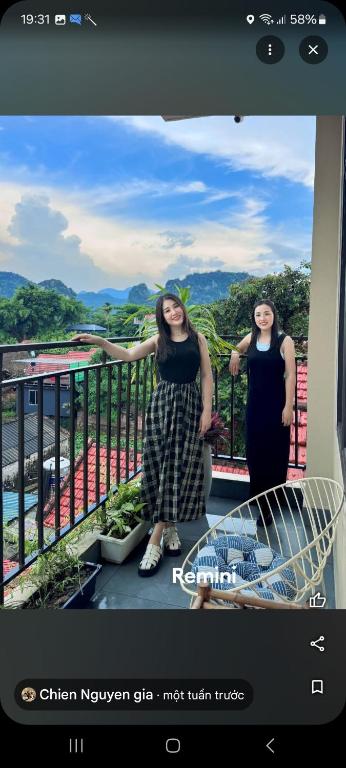 two women are standing on a balcony at Tam Coc Paradise Homestay in Ninh Binh