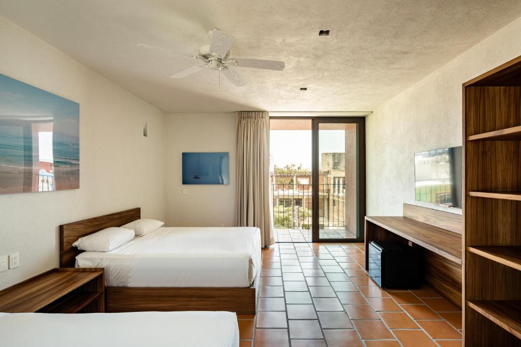 Postel nebo postele na pokoji v ubytování HOTEL AURELIA