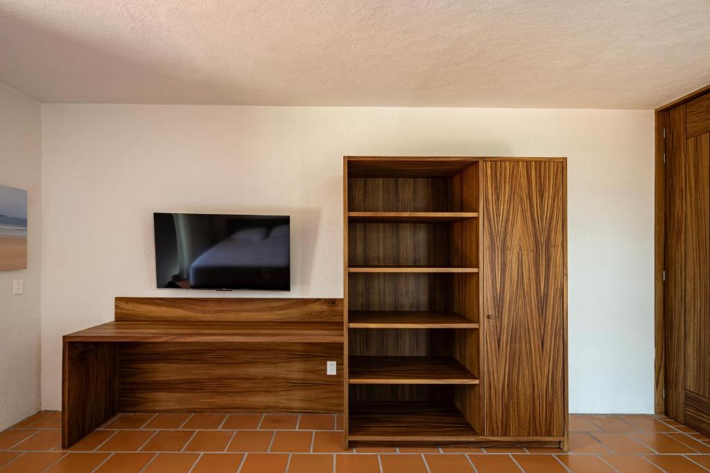 TV a/nebo společenská místnost v ubytování HOTEL AURELIA