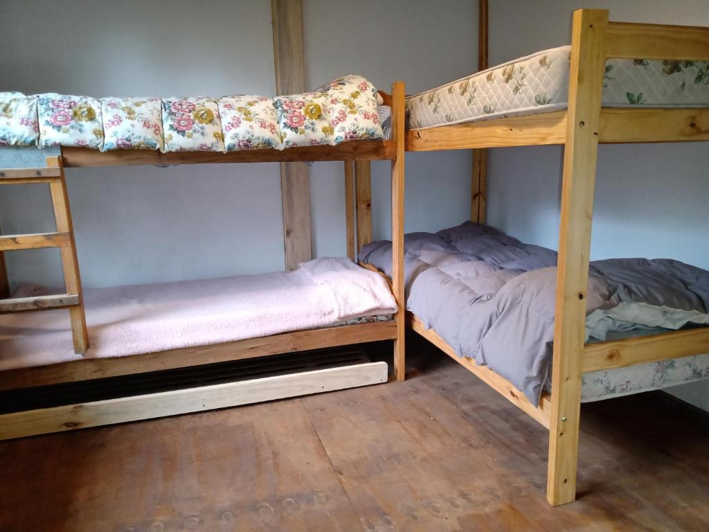 Postel nebo postele na pokoji v ubytování Cabaña Entre Lagos y Montañas