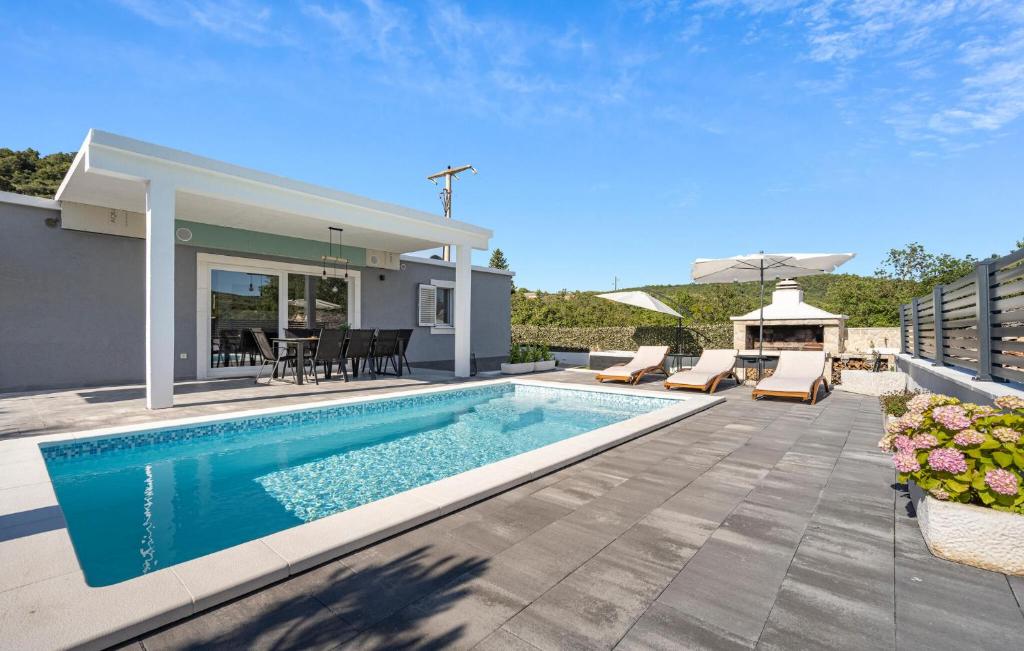 a swimming pool in the backyard of a house at Stunning Home In Krusevo in Kruševo