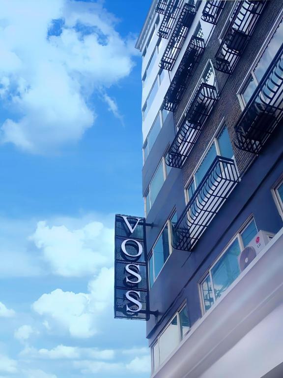a hotel sign on the side of a building at Voss Condominium in Manila