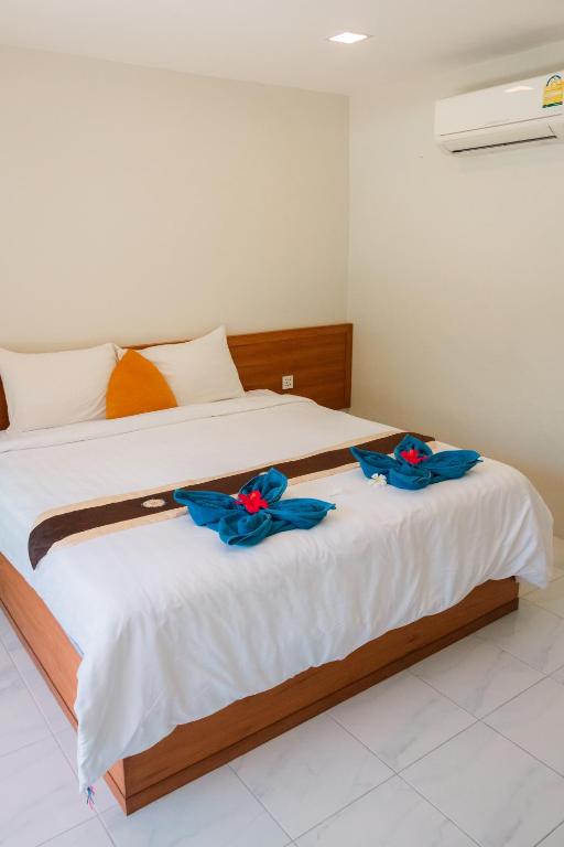 Postel nebo postele na pokoji v ubytování JP Resort Koh Tao