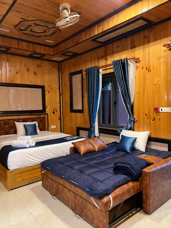Voodi või voodid majutusasutuse Resort Hàng Dương toas
