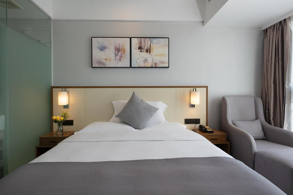Postel nebo postele na pokoji v ubytování Hongdu Hotel