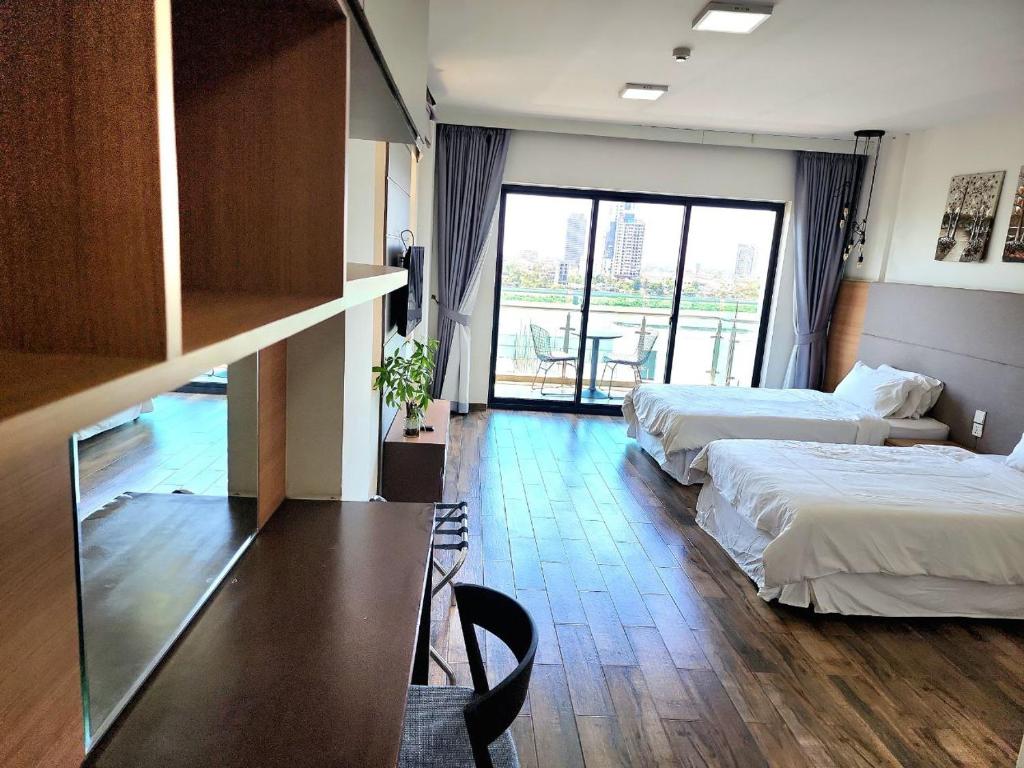Postel nebo postele na pokoji v ubytování CHILCHILL Hotel Riverside