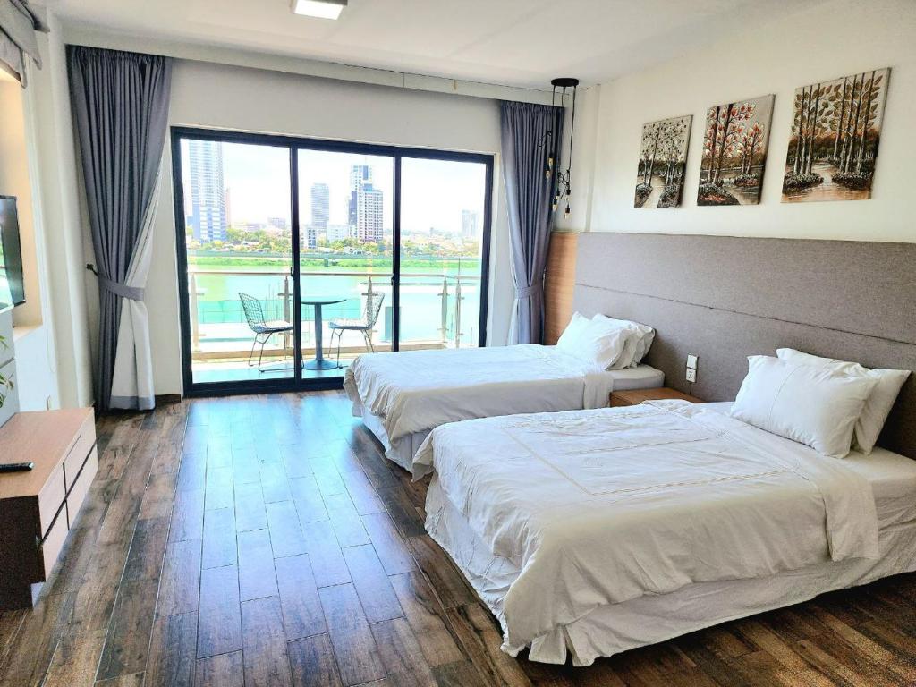 Postel nebo postele na pokoji v ubytování CHILCHILL Hotel Riverside