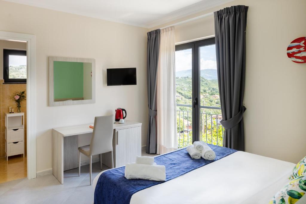 Postel nebo postele na pokoji v ubytování Scario Club