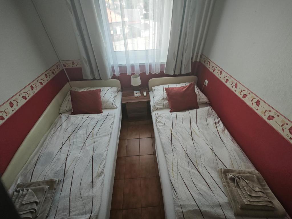 Posteľ alebo postele v izbe v ubytovaní Valley Vendégház
