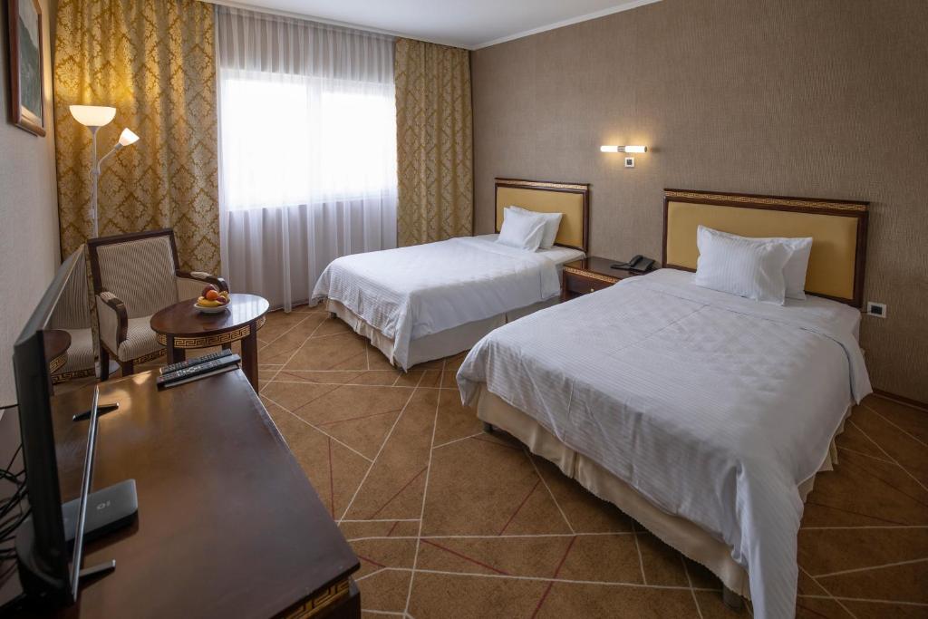Postel nebo postele na pokoji v ubytování Hotel Aquastar Danube