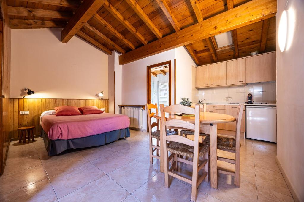 Postel nebo postele na pokoji v ubytování Aparthotel les Corts