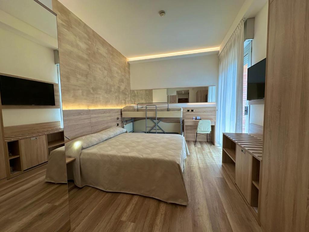 Postel nebo postele na pokoji v ubytování Hotel Beau Rivage Pineta