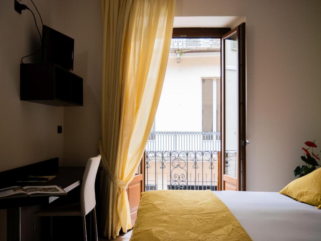 Łóżko lub łóżka w pokoju w obiekcie Hotel Ligure
