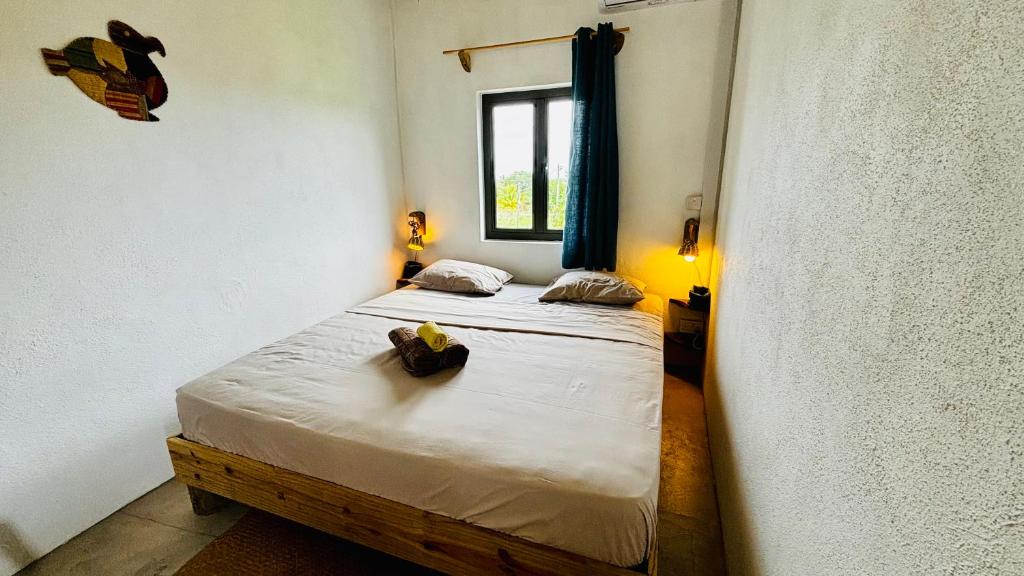 Postel nebo postele na pokoji v ubytování Ti Kaséou 1