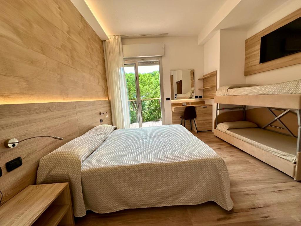 Postel nebo postele na pokoji v ubytování Hotel Beau Rivage Pineta