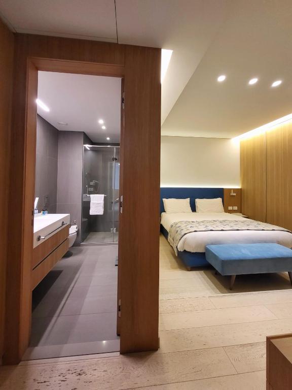 Postel nebo postele na pokoji v ubytování Monot Suites