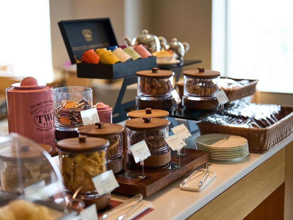 a buffet with many different types of food on a table at Cerulean Tower Tokyu Hotel, A Pan Pacific Partner Hotel in Tokyo