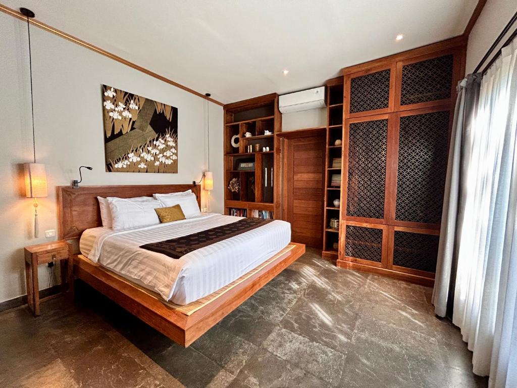 Postel nebo postele na pokoji v ubytování Karmagali Suites Adults only & Private Pool Family Villas