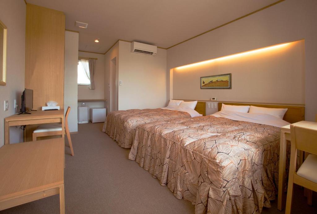 Postel nebo postele na pokoji v ubytování Family Stay Tsukuba Room